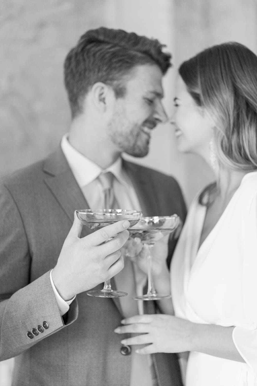 Bride and groom toast with champagne glasses