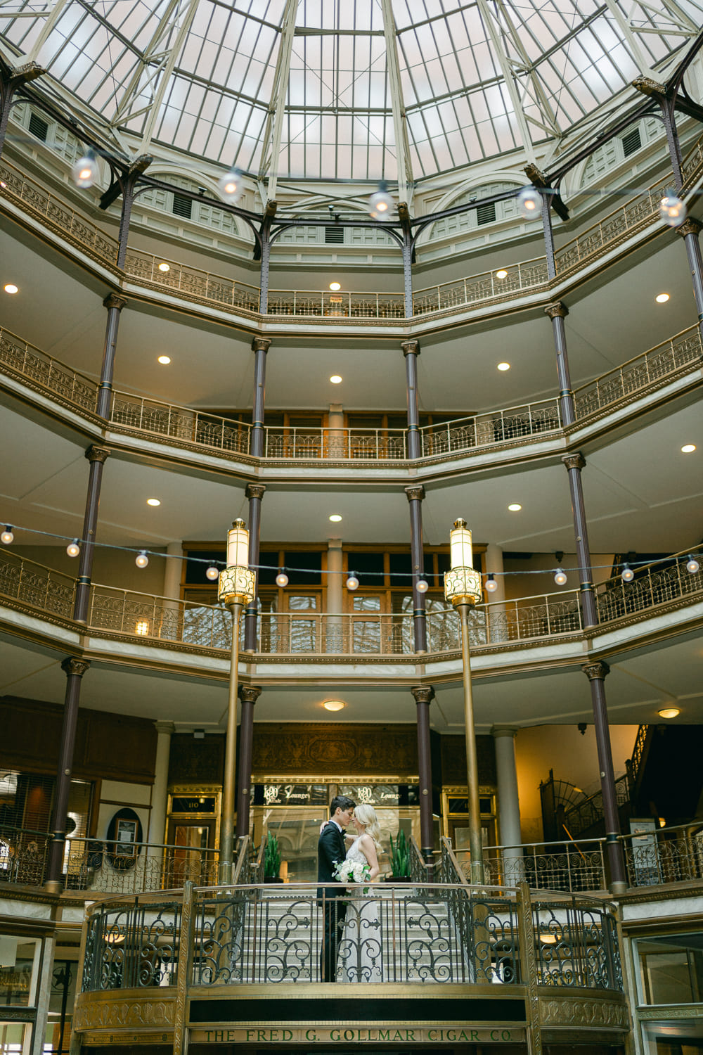 Wedding photo of bride and groom in big building The Arcade Cleveland